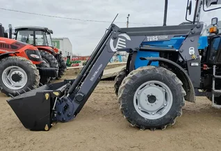 Фронтальный погрузчик TURS-1500М – идеален для зерновых и животноводческих хозяйств